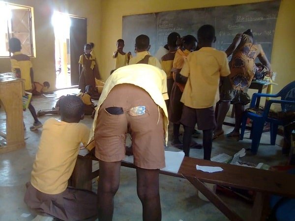 Pupils lie on belly to study