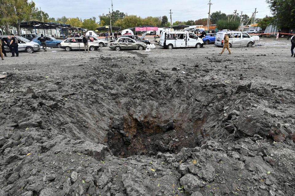 Civilians killed in Ukraine convoy attack as Putin to proclaim rule over seized land
