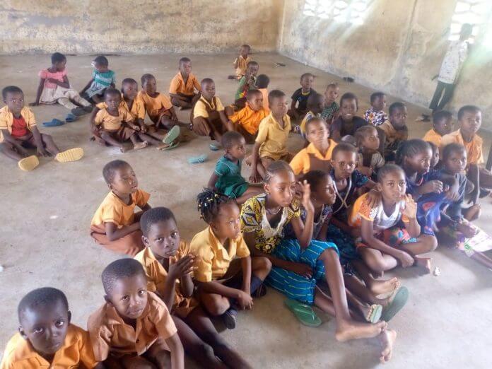 Pupils of Nakong Primary School lie on bare floor