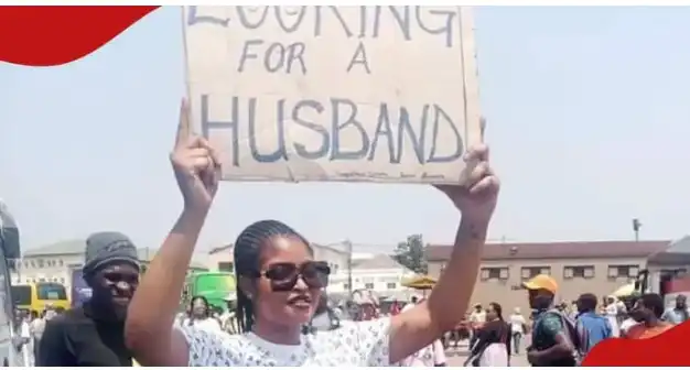 Whilst people were protecting Against Akuffo Addo; See What A woman was holding in Public